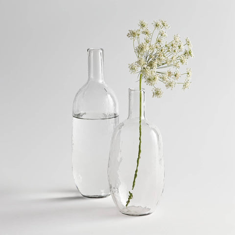 Short and tall pebbled glass bottles shown together; sold individually